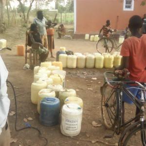Community Members Queuing For Water 1